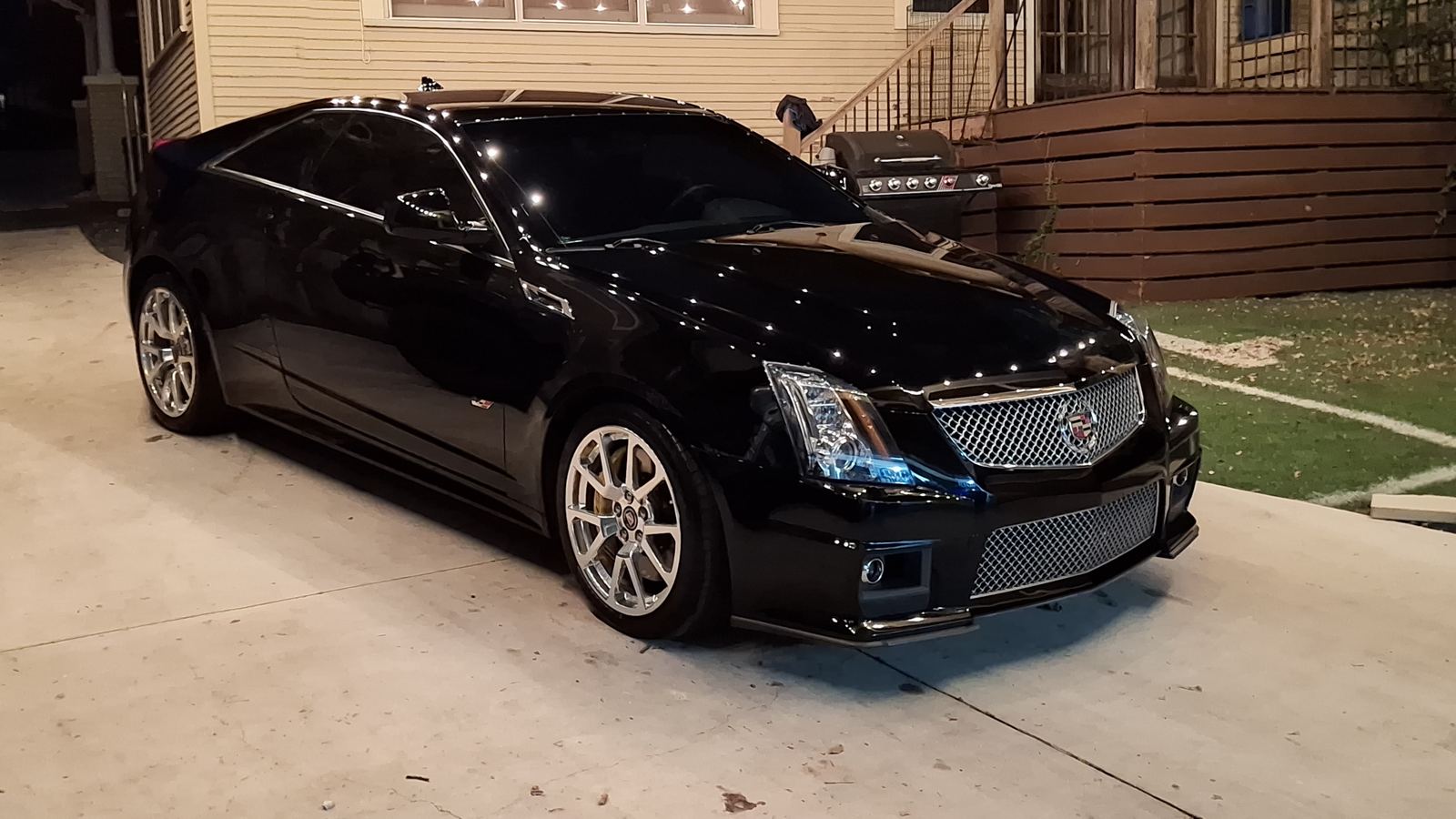 Black Cadillac CTS-V coupe at night